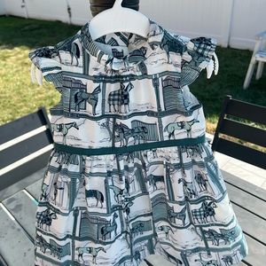 Infant dress in excelent used condition. Size 12/18 MO